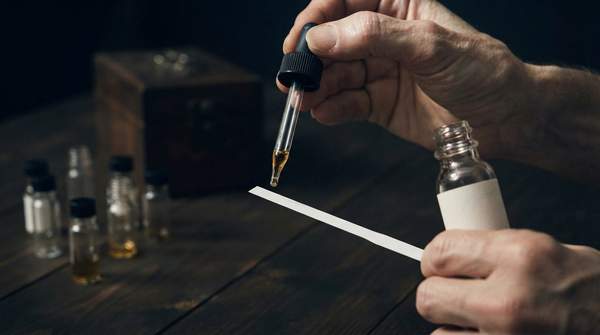 Editorial illustration for Custom Perfume: Choosing Between Guided Blending and True Bespoke Creation