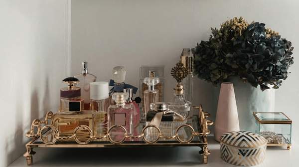 Editorial illustration for How to Layer Fragrances: A Goal-Based Framework for Building Your Signature Scent